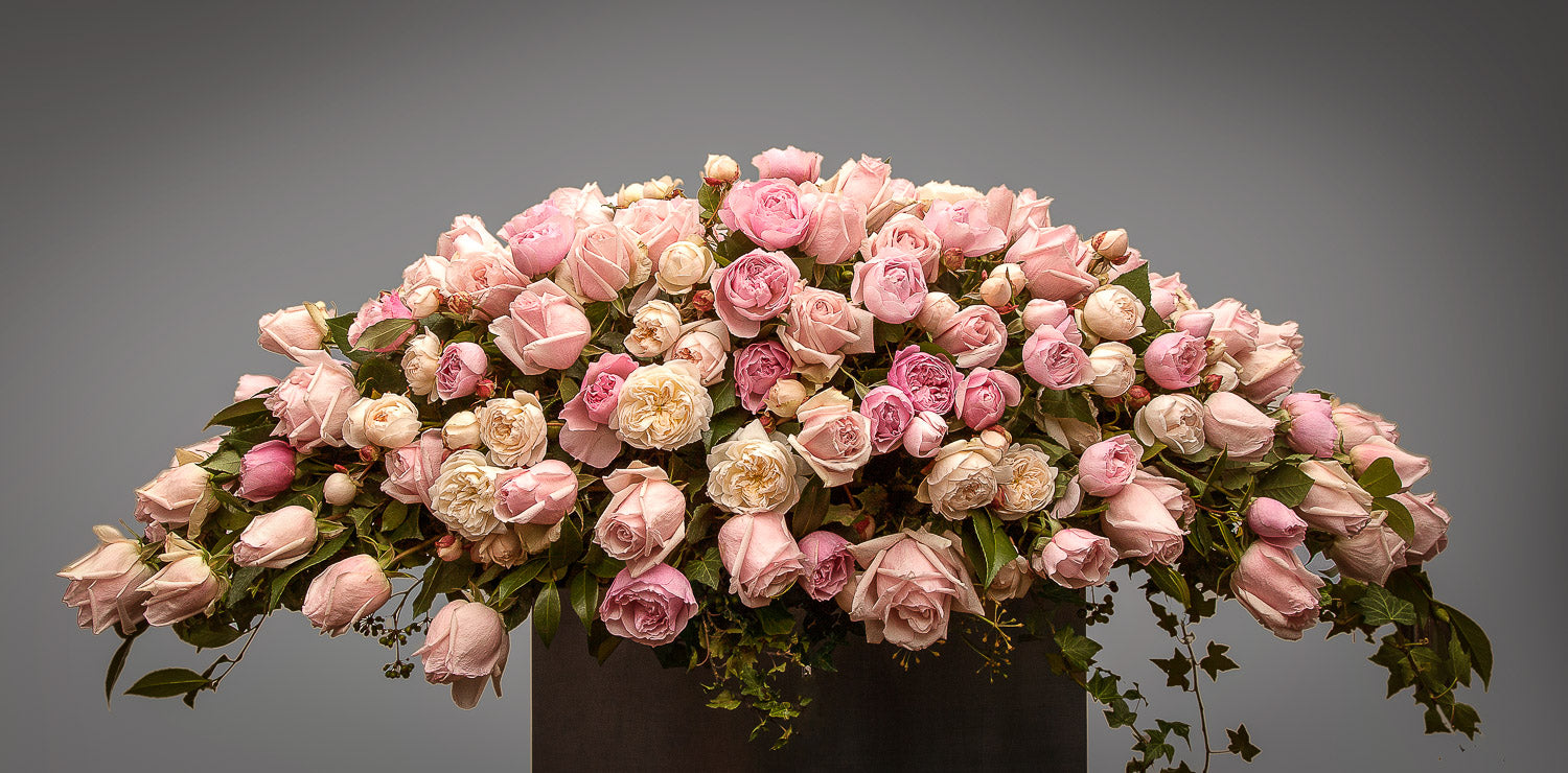 Bouquet of pink and white roses for a casket cover by Susan Avery
