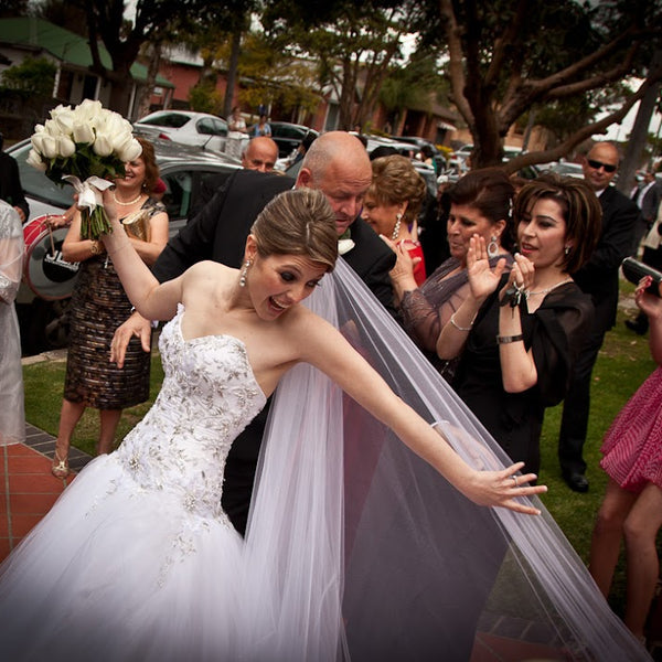 Bride celebrating outside with family and guests