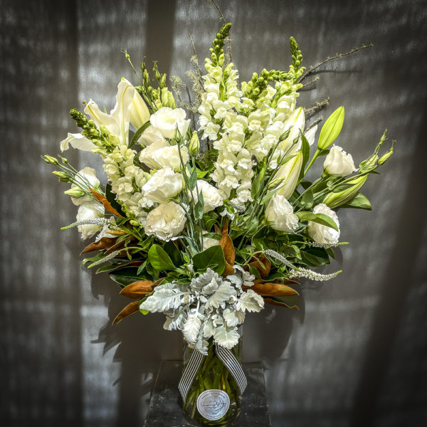 Beautiful white funeral arrangement